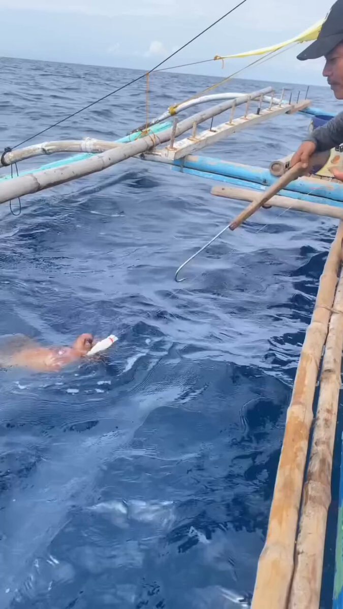 fishing boat with bamboo outriggers