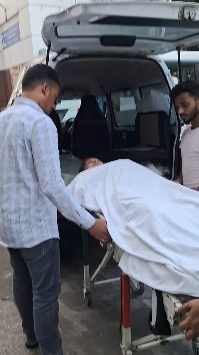 stretcher loaded into white van