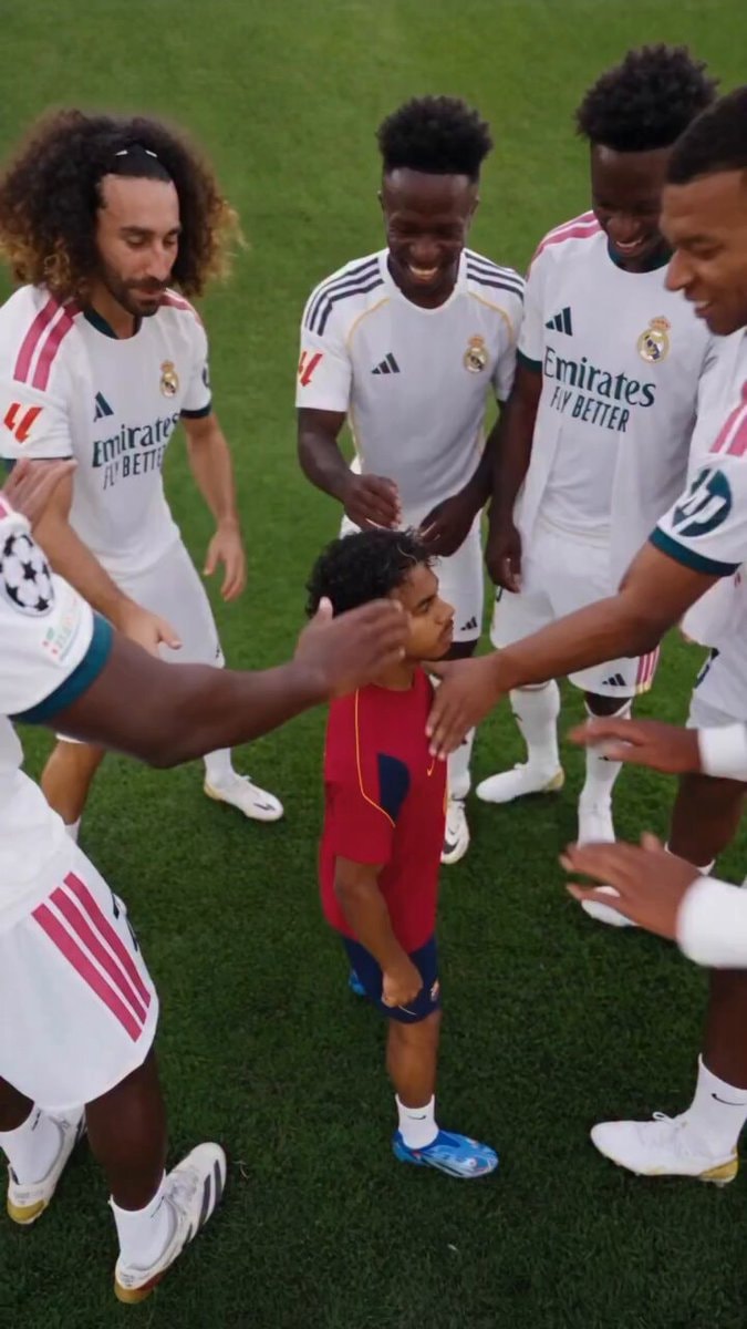 Soccer players and young fan moment