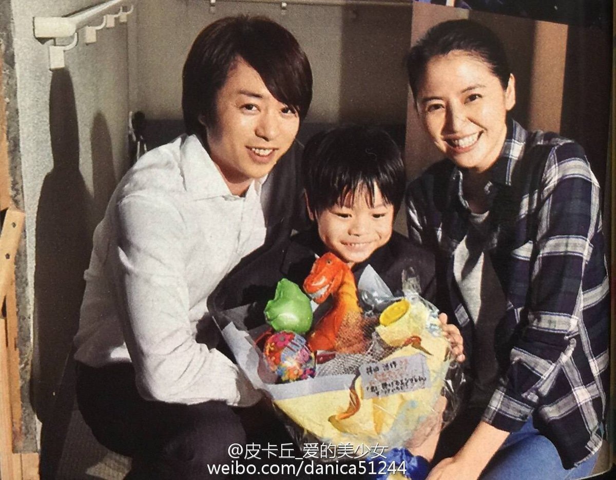 candid family photo with dinosaur toy