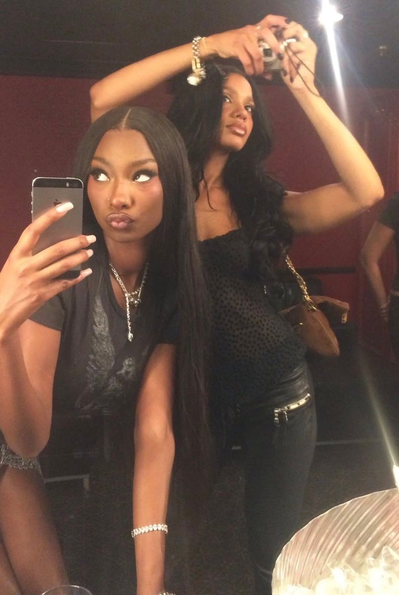 two women mirror selfie