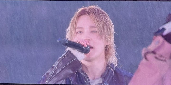 BTS performing in the rain during their tour (photo 3 of 4)