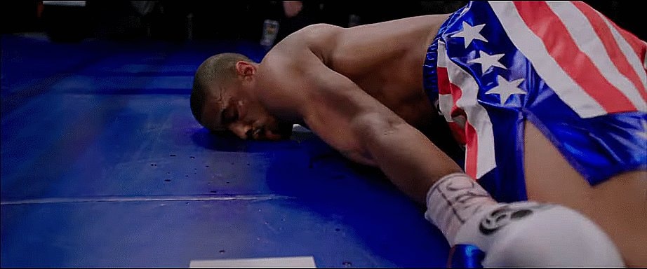 Boxer on his knees in the ring