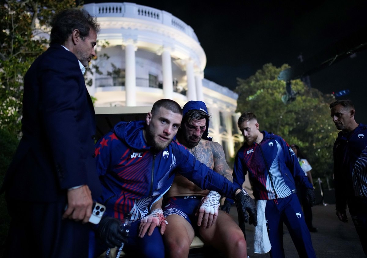 Ilia Topuria and Alexander Volkanovski on golf cart (photo 2 of 2)