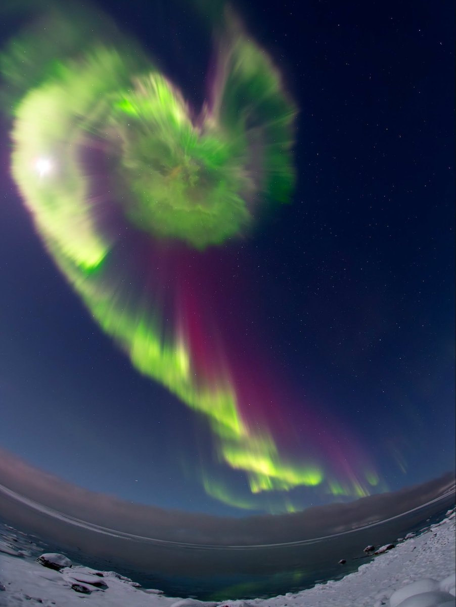 Northern lights over frozen fjord