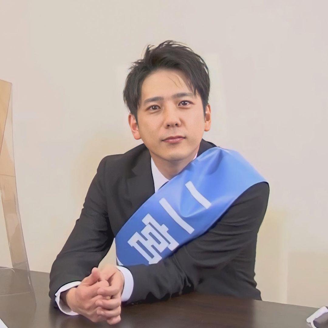 playful boy in blue jacket (photo 4 of 4)