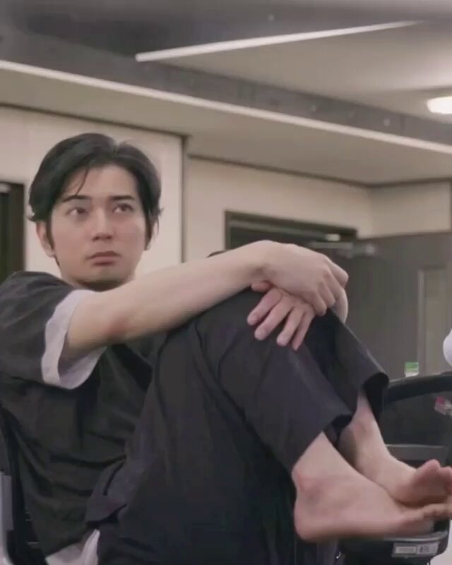 young man seated 5x20