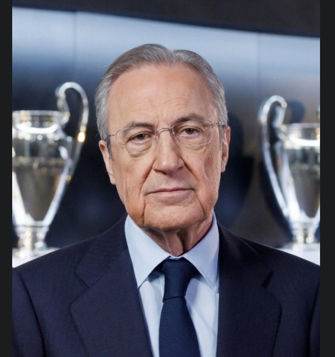 Florentino Pérez portrait with Real Madrid trophies