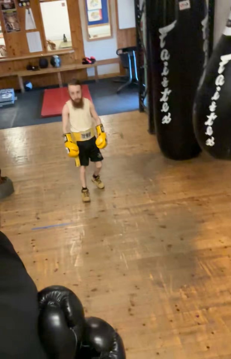 boxing gym man with yellow gloves