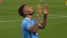 soccer player in light blue jersey