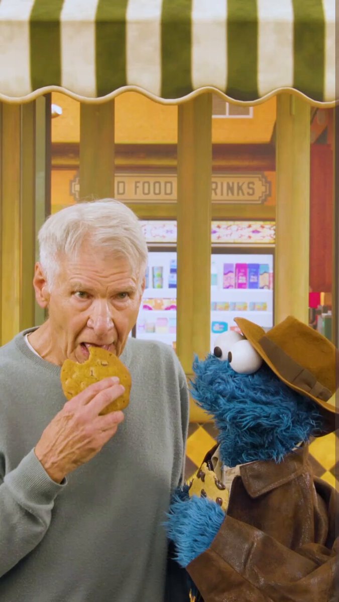 Harrison Ford shares cookie with Cookie Monster Harrison Ford shares cookie with Cookie Monster