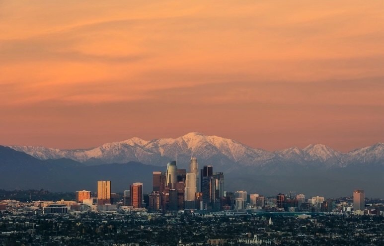 City skyline with mountains at sunset (photo 1 of 4)