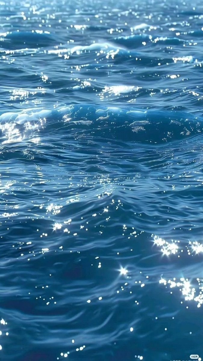 peaceful ocean scene with sparkling waves (photo 1 of 3)