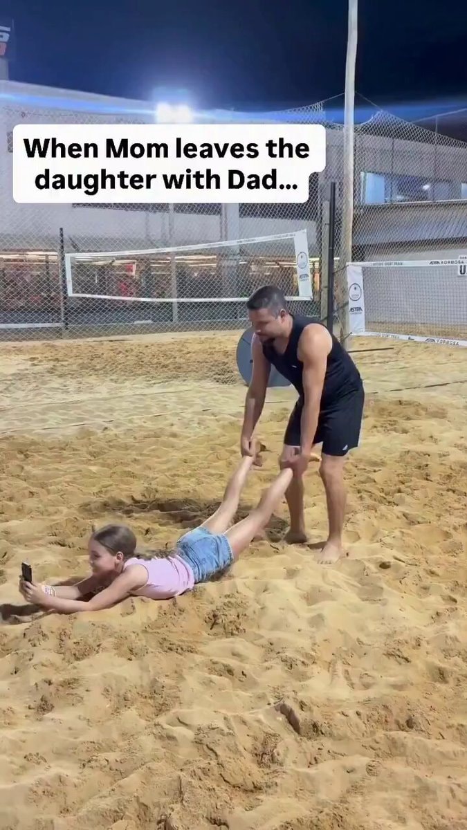 Dad on kid duty beach moment