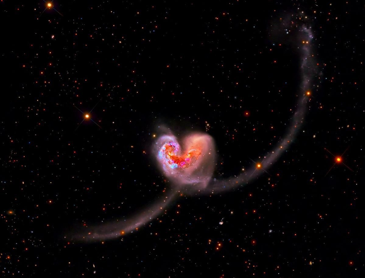 heart-shaped galaxy with star trail