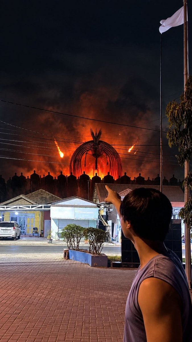 person pointing at dramatic scene