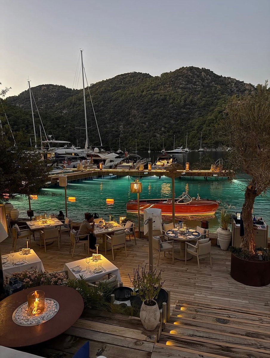 Serene Marina Dinner Setup at Dusk (photo 2 of 3)