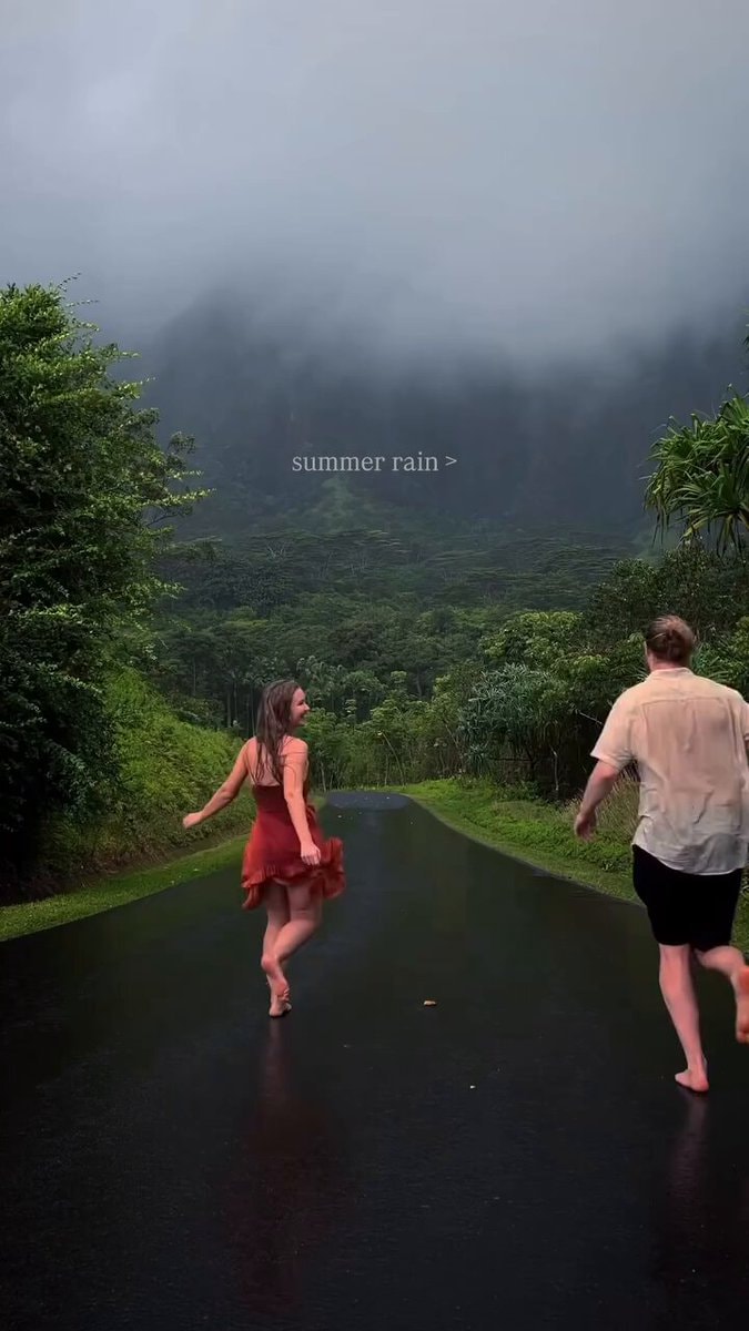 couple running in summer rain