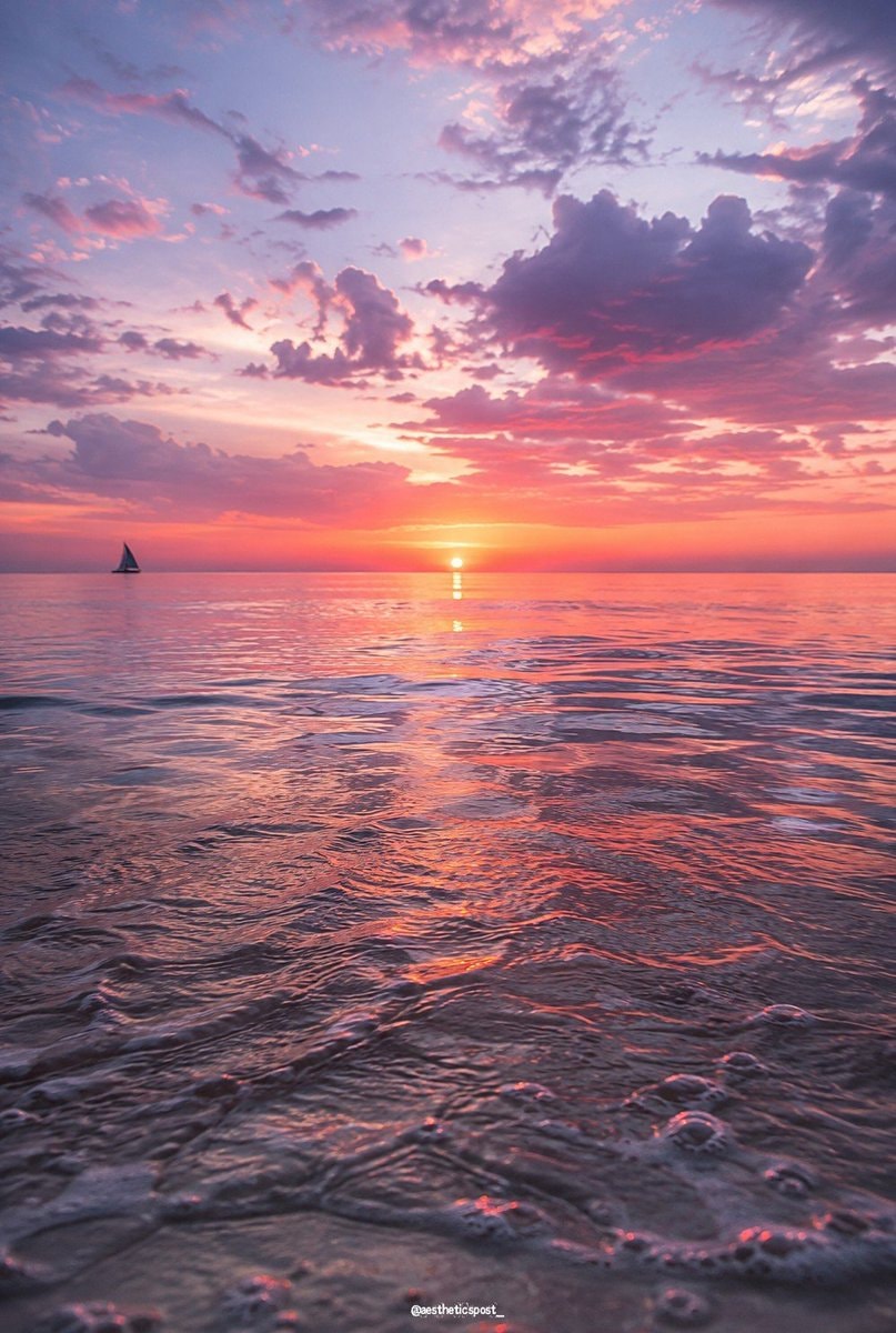 sunset ocean sailboat pink purple sky