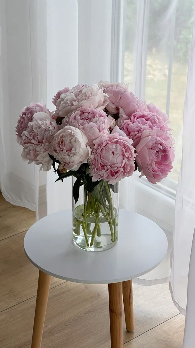 pink peonies in a glass vase