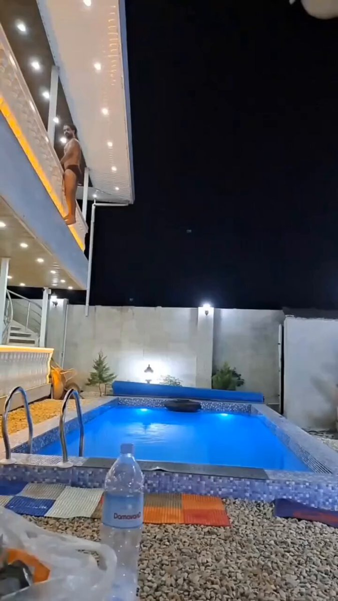 Man on balcony pool