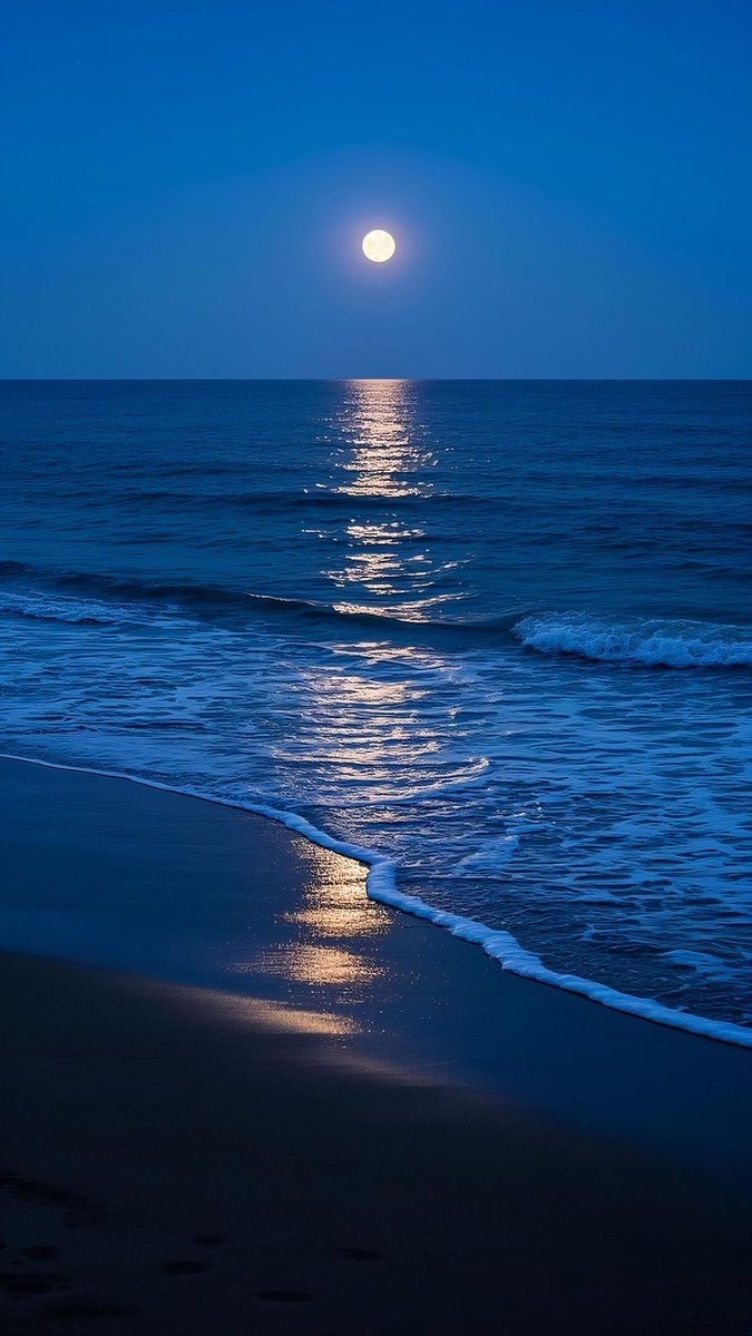 full moon rising over ocean