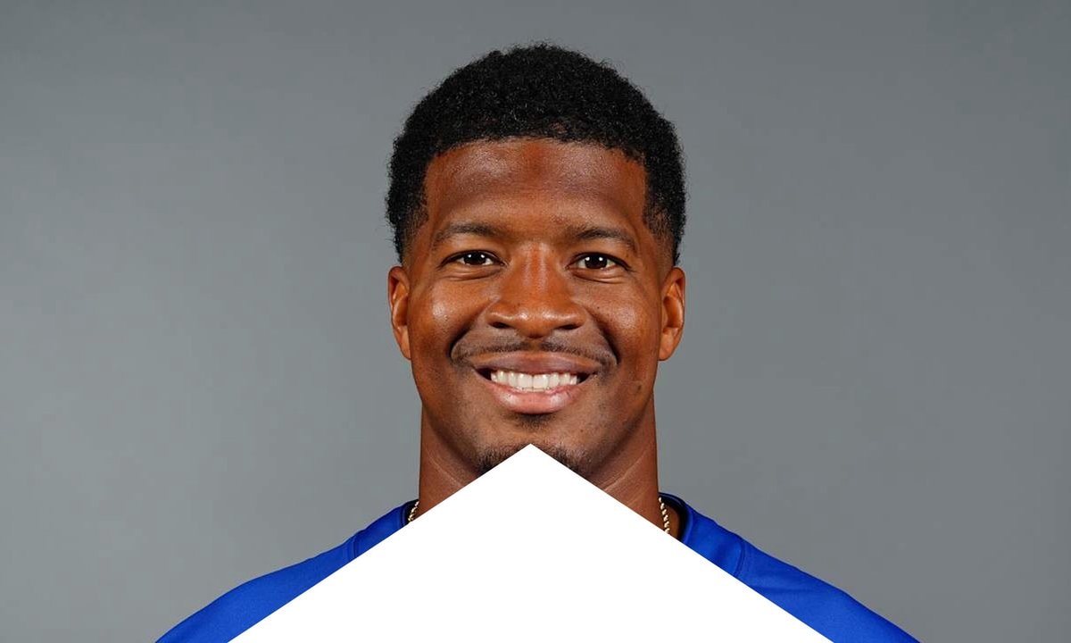 smiling man in blue shirt