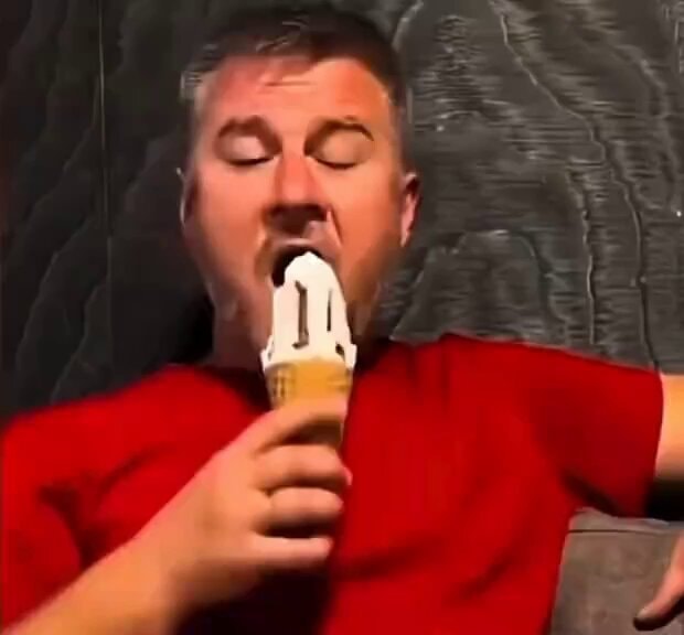 Man enjoying ice cream with eyes closed Man enjoying ice cream with eyes closed