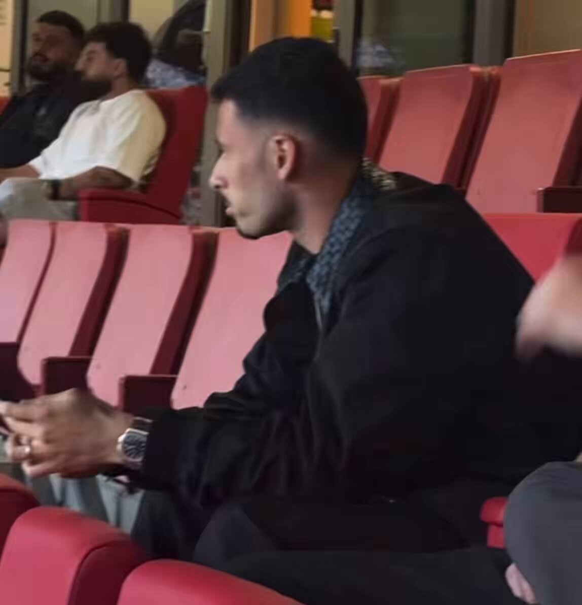 Man in stadium seats feeling sympathy