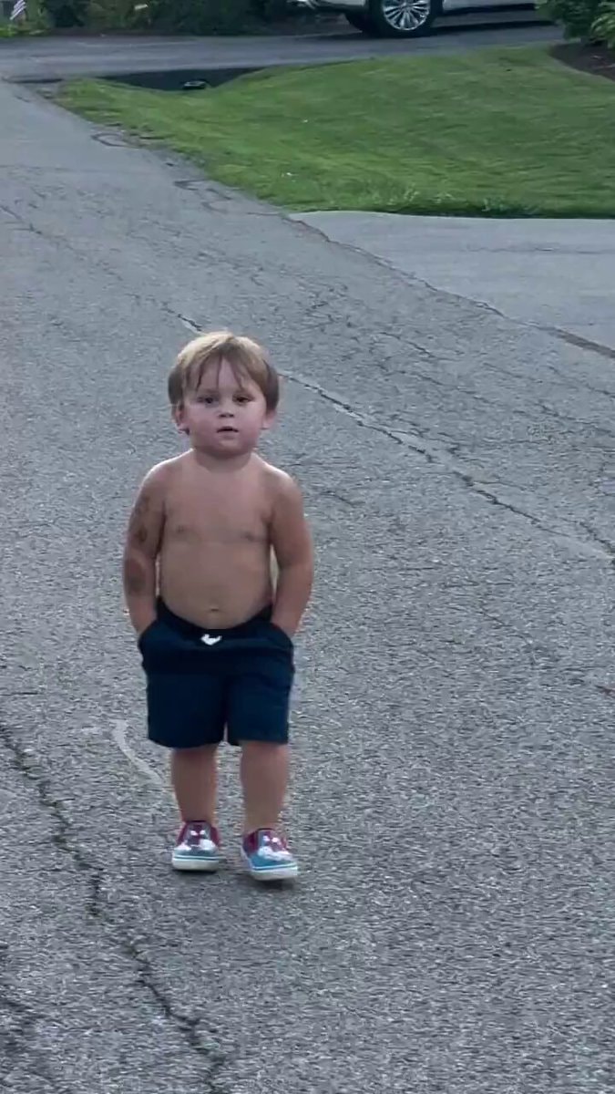 Shirtless boy walking