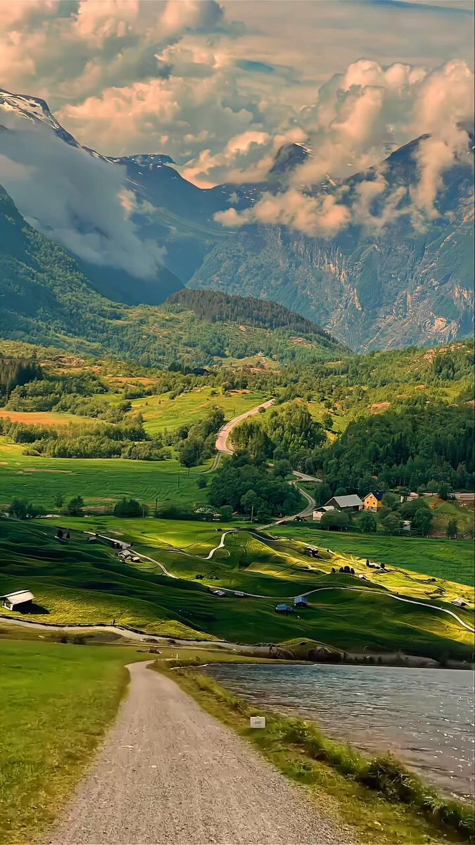rolling green hills with houses