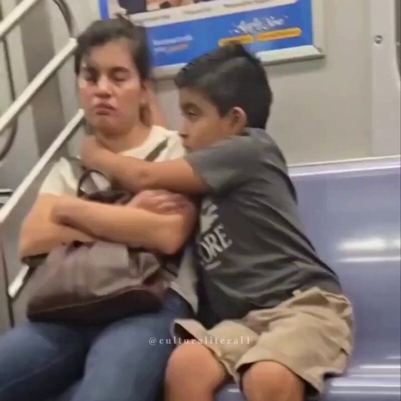 Son protects sleeping mom on train ❤️