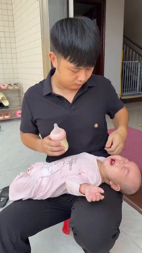 Smart dad feeding baby