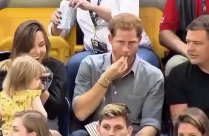 Prince Harry lets girl take popcorn