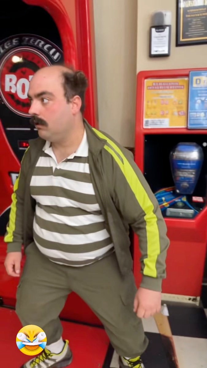 man strikes comical pose