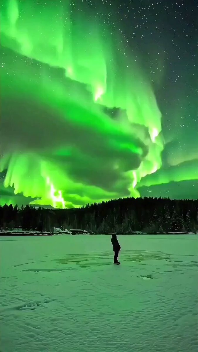 Aurora borealis over frozen expanse
