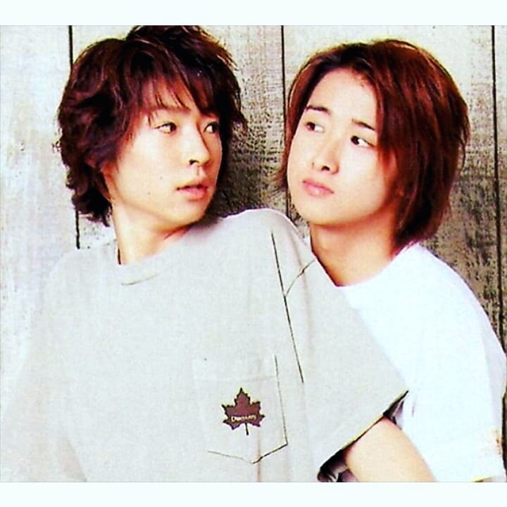 two young men posed together