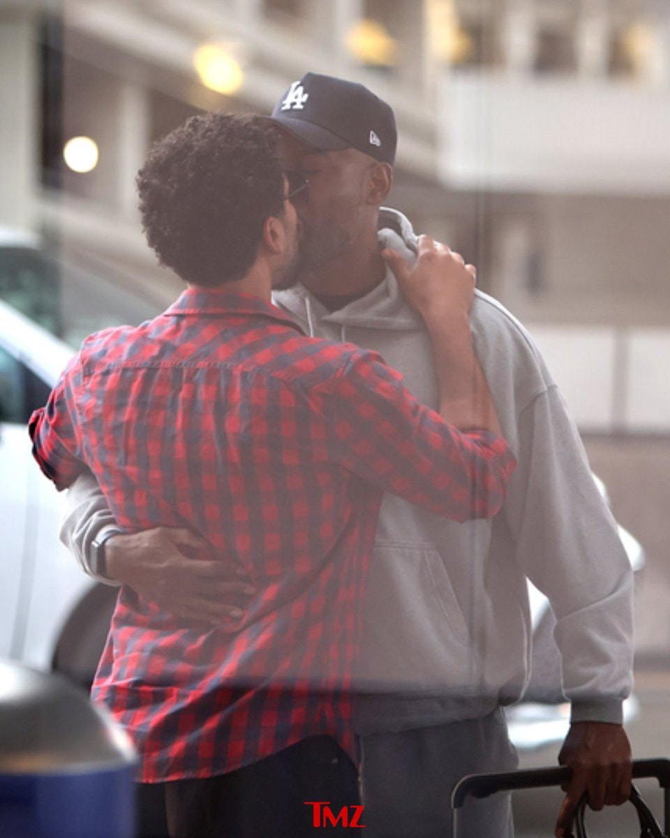 Jussie Smollett and Karamo Brown airport PDA
