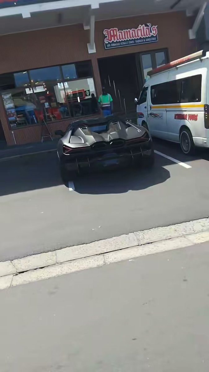 dark convertible parked outside