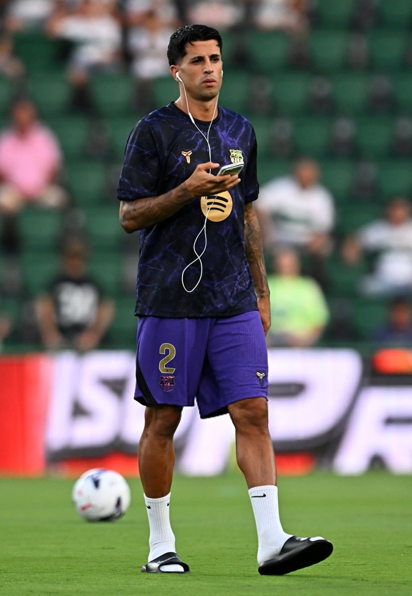 Joao Cancelo wearing slides
