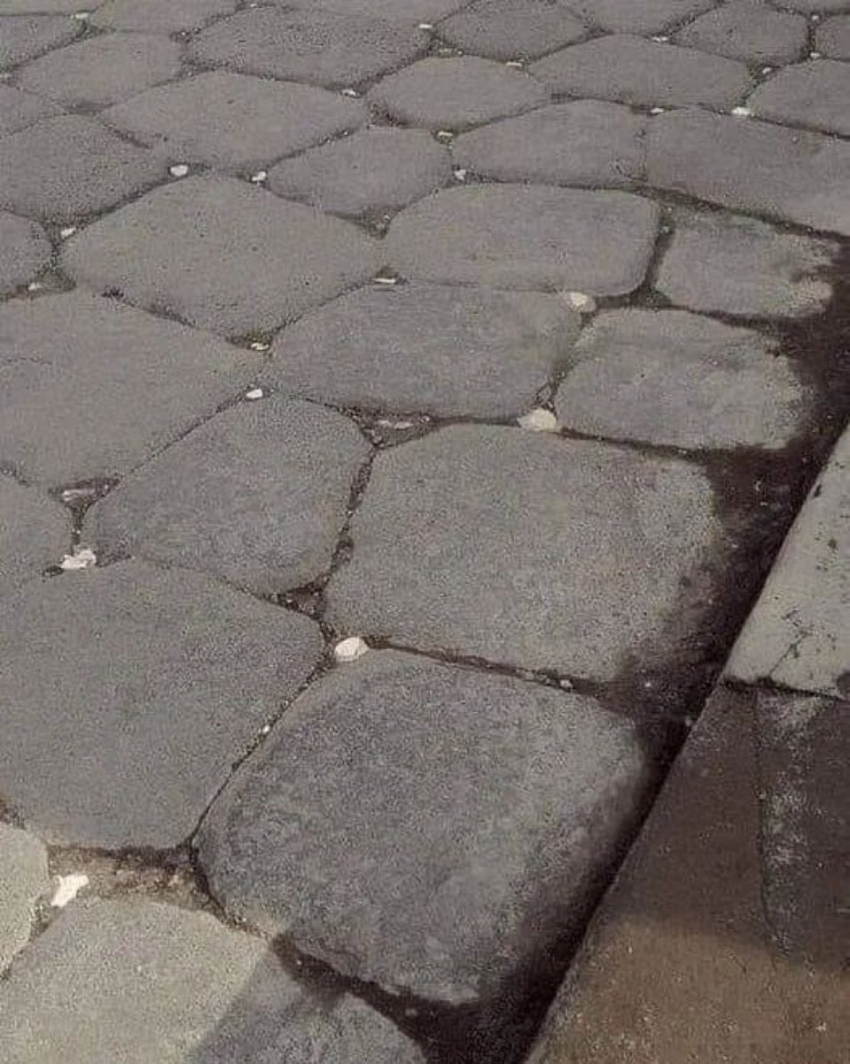 Pompeii road with moonlight-reflecting stones