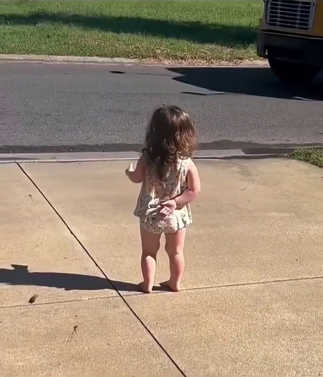 child runs barefoot to big brother