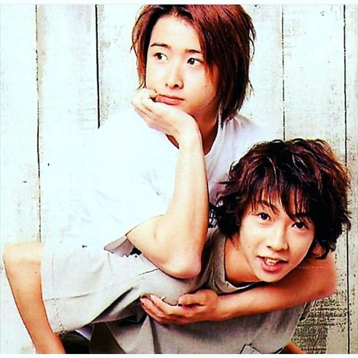 two young men posed together (photo 2 of 2)