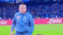 Man in blue tracksuit Lete banner