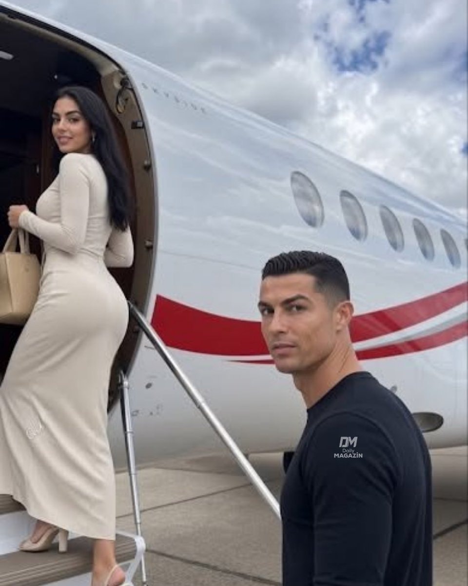 Georgina posing with husband on jet