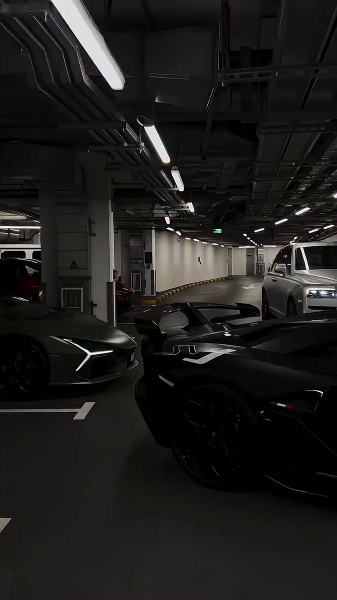 Luxury cars in parking garage