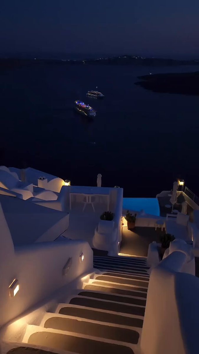 Greece cliffside resort at night