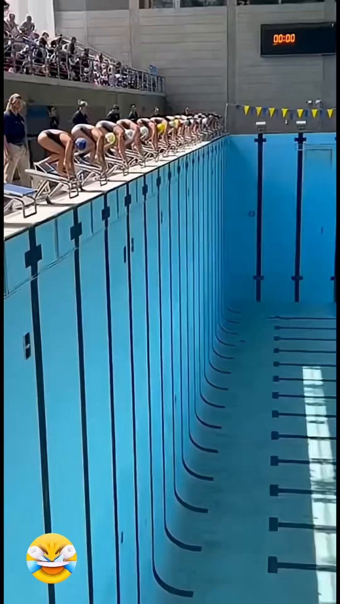 swimmers on blocks at start