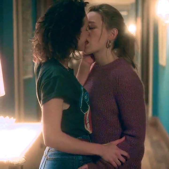 Intimate hallway kiss