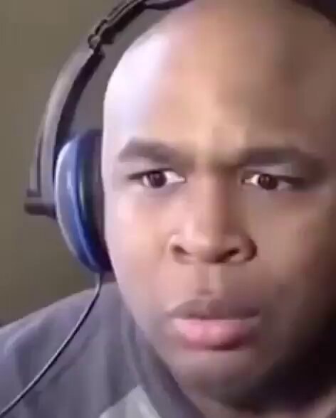 Man reacts with wide eyes